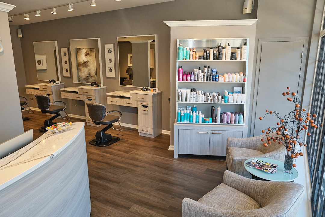 Inside Wesley James Salon — styling stations, retail shelf, and lounge
