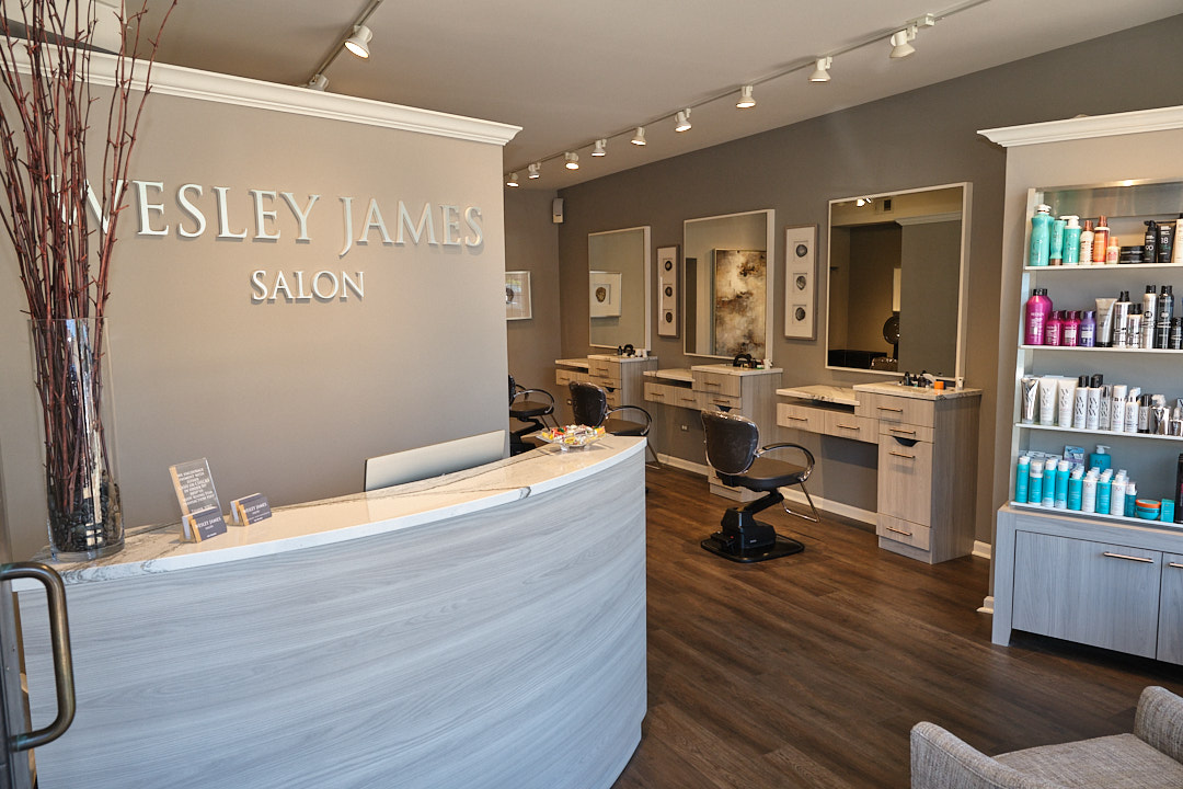 Reception desk and the Wesley James Salon wall lettering