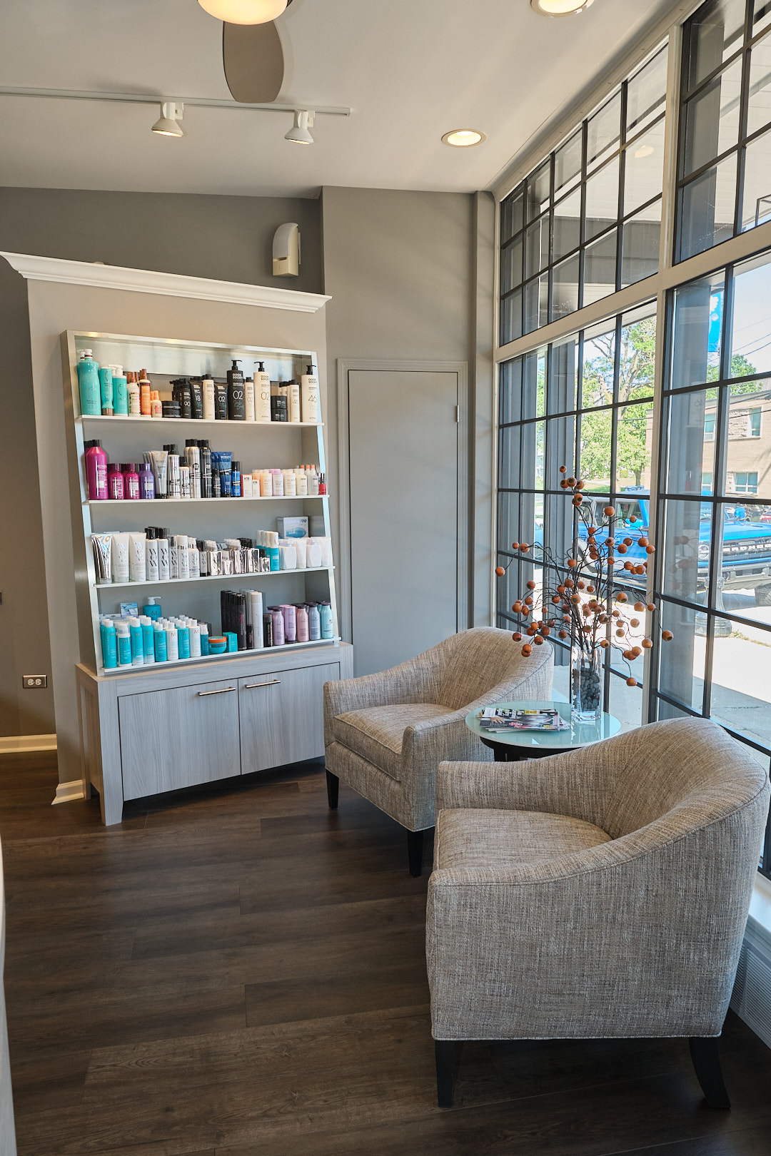 Lounge seating and retail shelf at Wesley James Salon